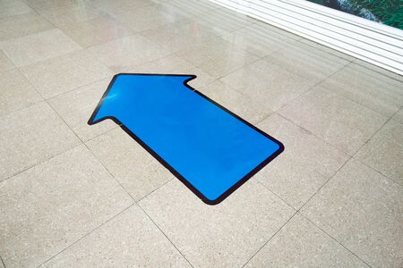 blue aarow on groundの写真素材