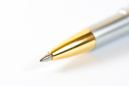 Silver ballpoint pen isolated on the whiteの写真素材
