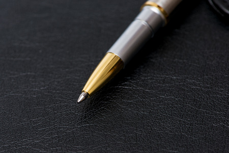 Notepad with ball penの写真素材