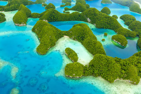 view of tropical islands and Pacific ocean from aboveの写真素材