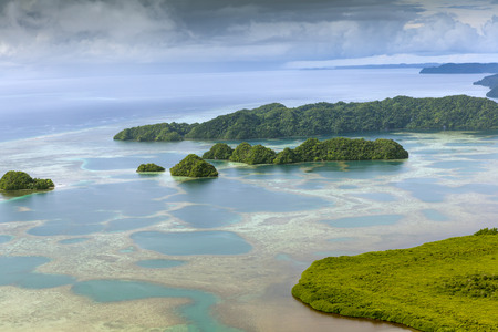view of tropical islands and Pacific ocean from aboveの写真素材