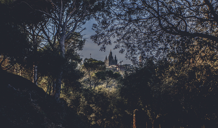 Panoramic mountain landscape in a city Barcelona. Europa, Barcelona, Spain. Old Building in Barcelona, Spain. Top view of the city. Barselona panorama. Temple Sacred Heart of Jesus on Tibidabo in Barcelonaの写真素材