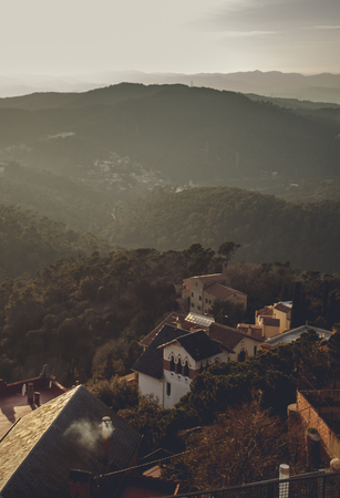 Panoramic mountain landscape in a city Barcelona. Europa, Barcelona, Spain. Old Building in Barcelona, Spain. Top view of the city. Barselona panorama. Temple Sacred Heart of Jesus on Tibidabo in Barcelonaの写真素材