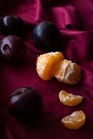 tangerine, mandarins and plums background for text