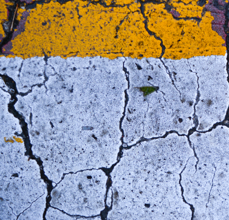 cracked asphalt yellow white composition texture minimalism conceptualism art photo backgroundの写真素材