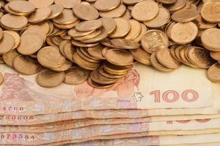 Ukrainian money, hundred hryvnias and coins ten kopeck