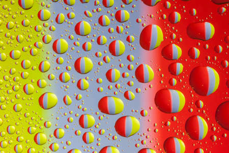 many colorful water drops on even surfaceの写真素材