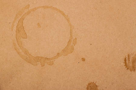 coffee cup and drop spots on kraft backgroundの写真素材