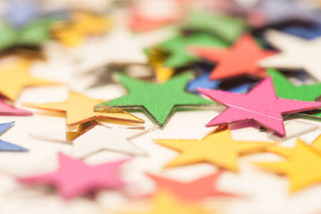 many colorful toy stars on white backgroundの写真素材
