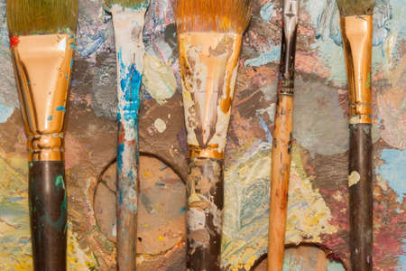 oil paints and brushes can be used as backgroundの写真素材