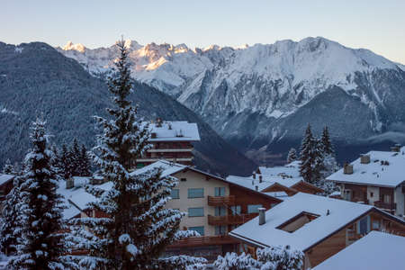 Morning in mountain winter village Verbier Switzerland