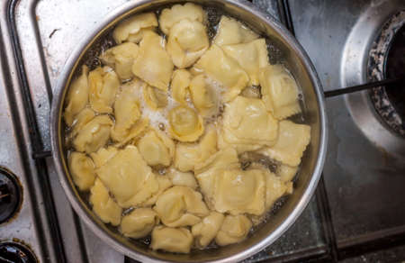 ravioli in sauce pan can be used as backgroundの写真素材