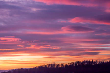cloudy blue and red sky on sunset as background