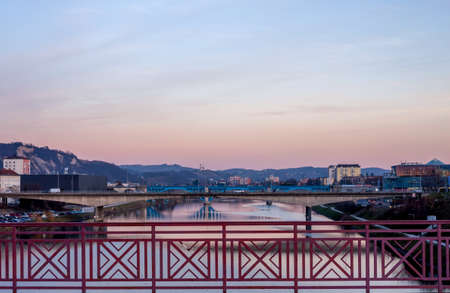 Sunset over the river and bridges in Slovenian city Mariborの写真素材