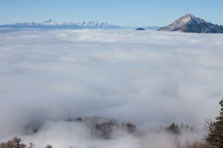 View on mountains and blue sky above cloudsの写真素材