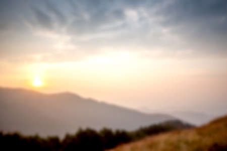 foggy mountain sunset can be used as backgroundの写真素材