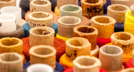set of spools of thread can be used as background