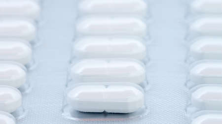 white pills in blister pack can be used as background