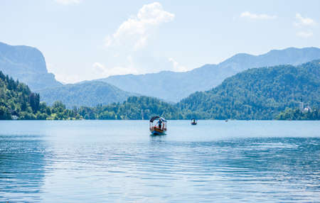 few boats on lake Bled in Sloveniaの写真素材