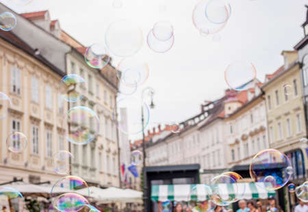 Soap bubbles on background of old town of Ljubljana