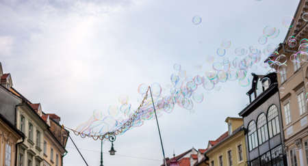 Soap bubbles on background of old town of Ljubljana