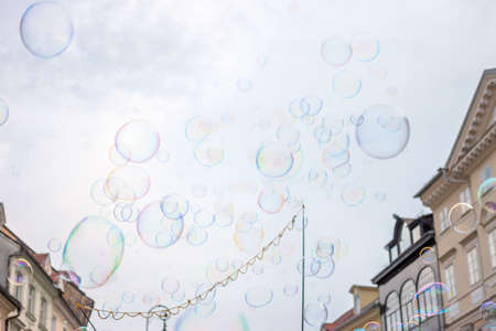 Soap bubbles on background of old town of Ljubljanaの写真素材