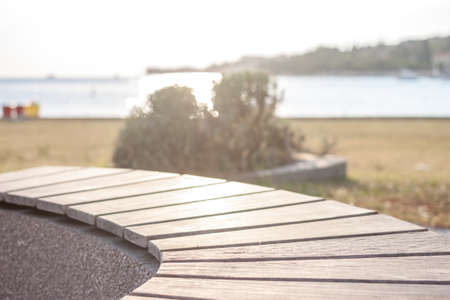 bench on the seaside in fornt of sunsetの写真素材