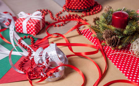 christmas presents and decoration preparation different paper and tapesの写真素材