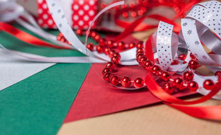 christmas presents and decoration preparation different paper and tapesの写真素材