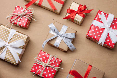 many different christmas presents on craft paper backgroundの写真素材