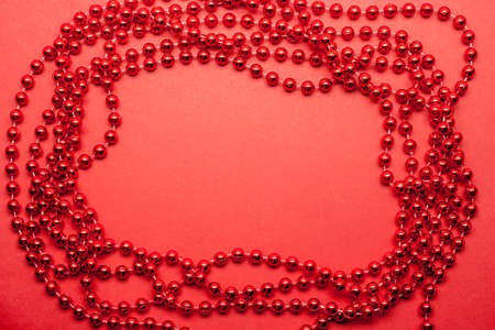 red garland on red background in shape of frameの写真素材