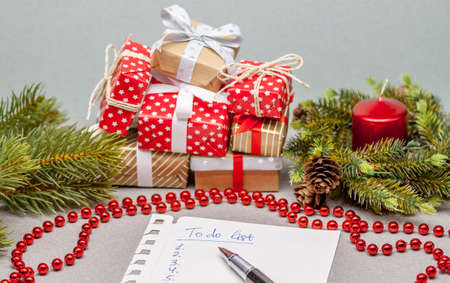to do list among christmas presents on craft backgroundの写真素材