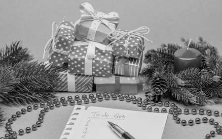 to do list among christmas presents on craft backgroundの写真素材