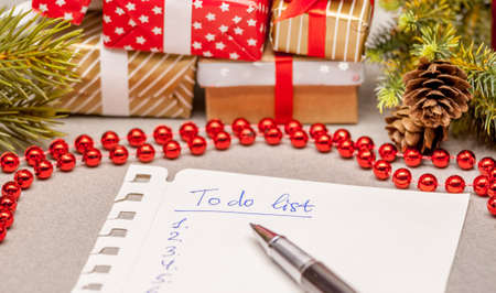 to do list among christmas presents on craft backgroundの写真素材