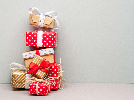 high pile made of different christmas gifts on craft paper