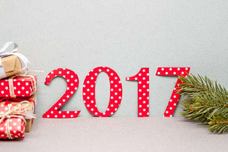 number 2017 cut of wraping paper and pile of giftsの写真素材