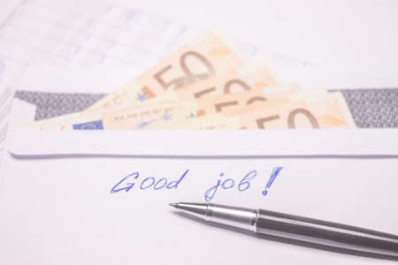 envelope with evro bills and good job sign