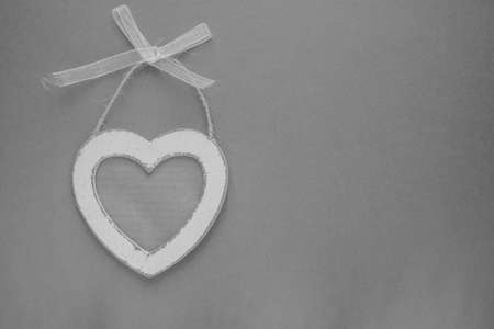wooden heart with free space on grey craft backgroundの写真素材