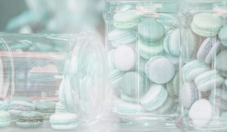 blue macaroons in glass jarsの写真素材