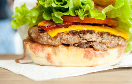 tasty beef burger with cheese tomato and lettuceの写真素材