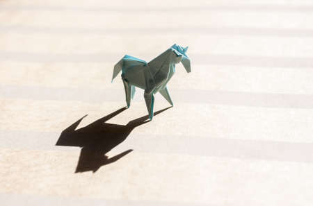origami horse on paper fieldの写真素材