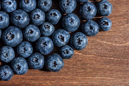 fresh big blueberries on wooden backgroundの写真素材