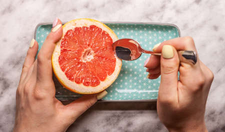 red grapefruit rectangular plate and spoonの写真素材