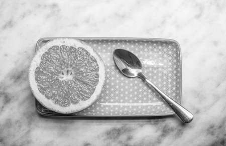 black white grapefruit rectangular plate and spoonの写真素材