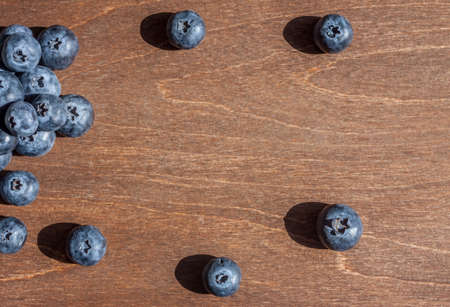 fresh big blueberries on wooden backgroundの写真素材