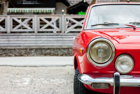 red retro car in the countrysideの写真素材
