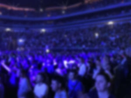 blurred concert background light show fans and visitorsの写真素材
