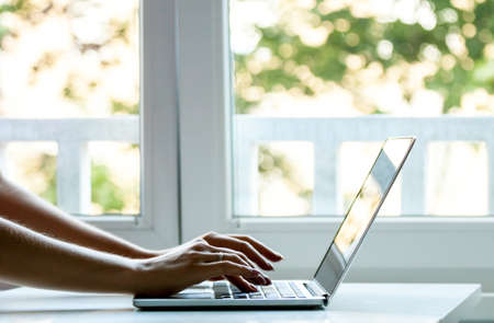 laptop computer female hands typing