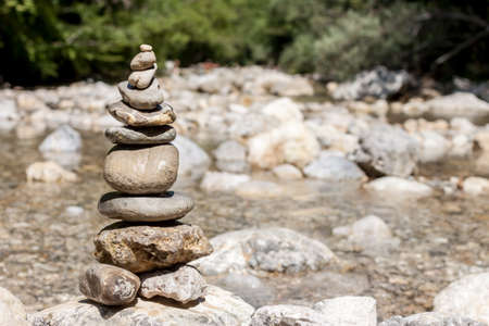 balancing stones on the mountain riverの写真素材