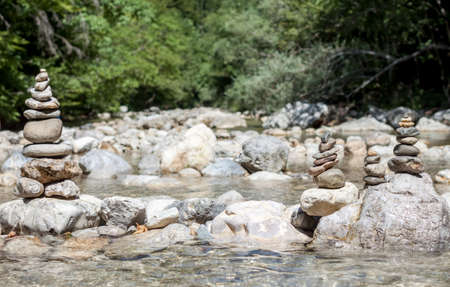 balancing stones on the mountain river blurred backgroundの写真素材